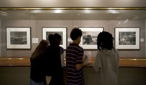 Students viewing photographs of Tibet by Kenro Izu in the exhibition Sacred Places, 2008, photograph by Eric Wheeler for the DIA